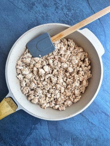 A skillet of sautéed ground chicken.
