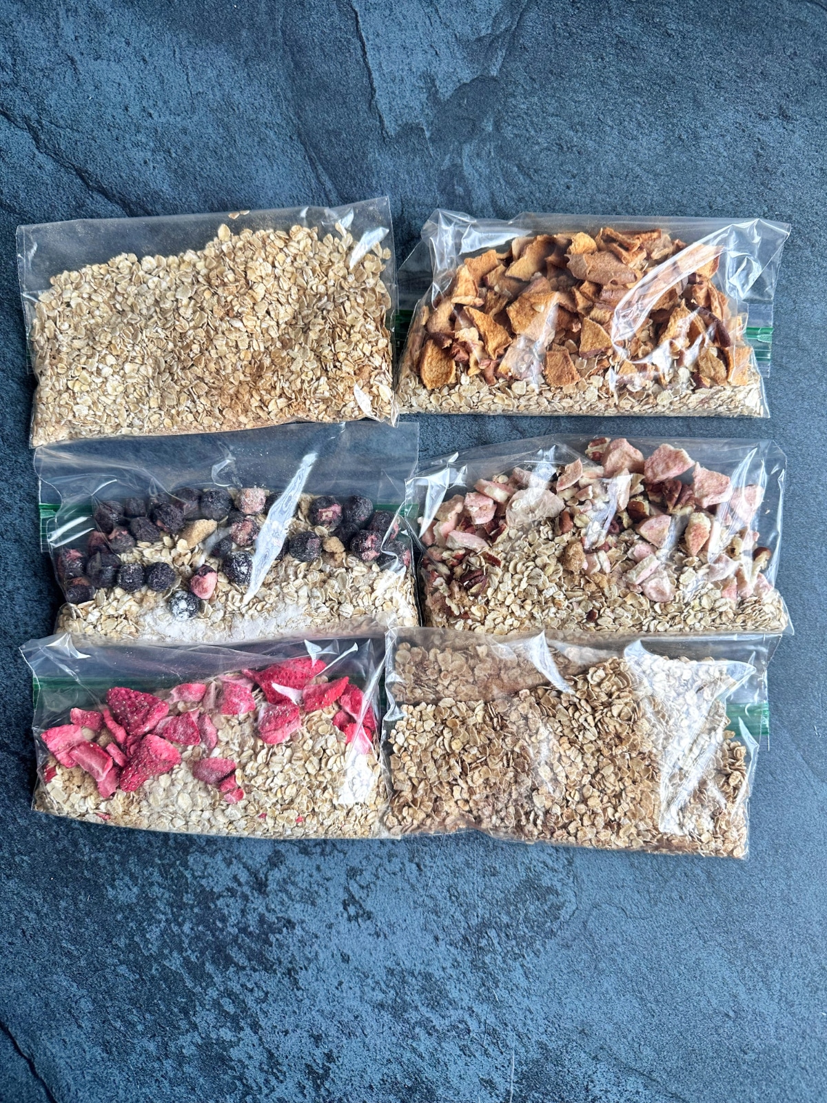 Six plastic storage bags filled with homemade DIY instant oatmeal packets.
