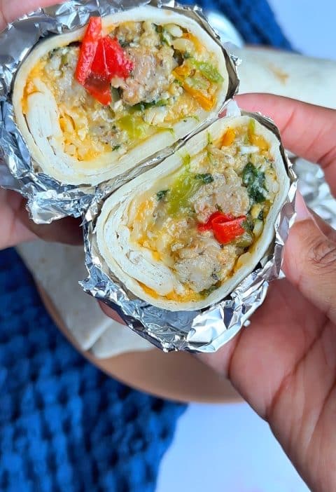 A closeup shot on the inside of a Chicken Sausage, Egg, and Cheese Southwest-Style Burrito.