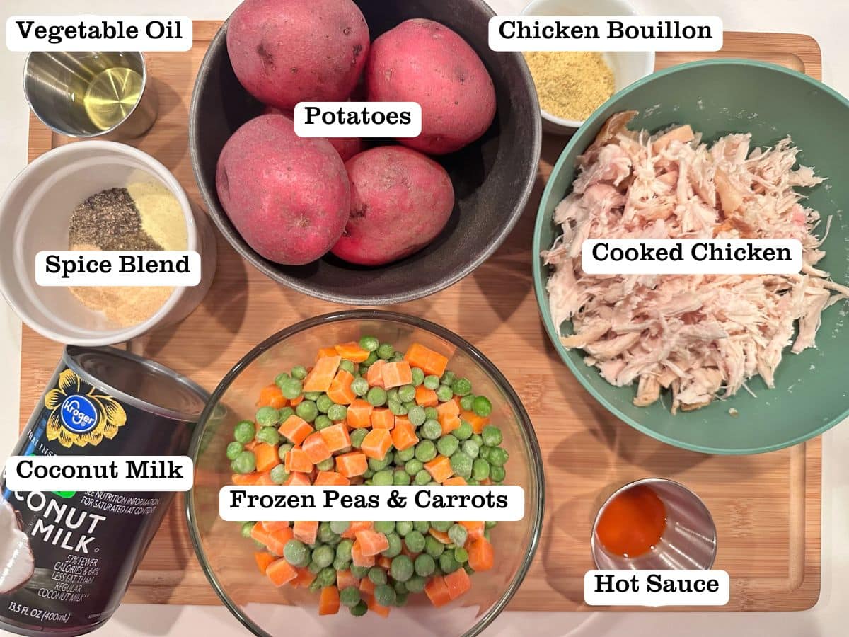 The ingredients for chicken pot pie soup, including frozen veggies, coconut milk, and potatoes.