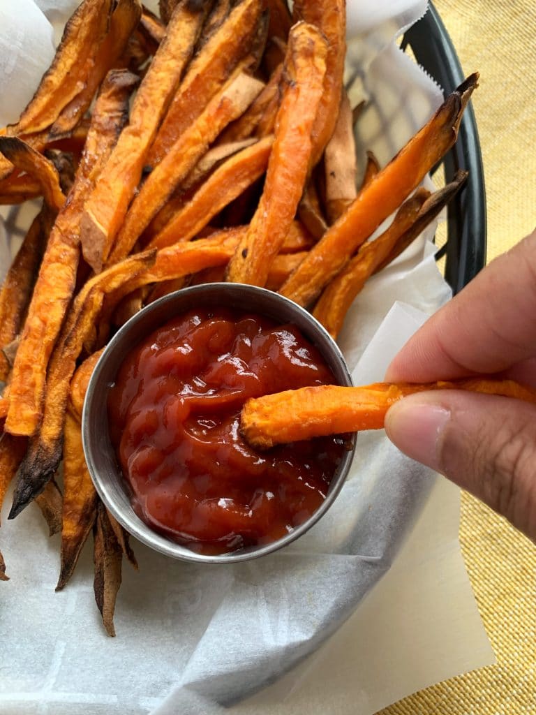 air fried sweet potato fries with ketchup in a small bowl
