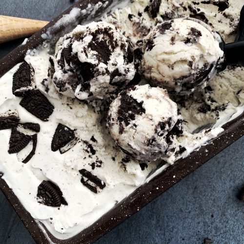 No churn cookies and cream ice cream with cones on the side of the pan.
