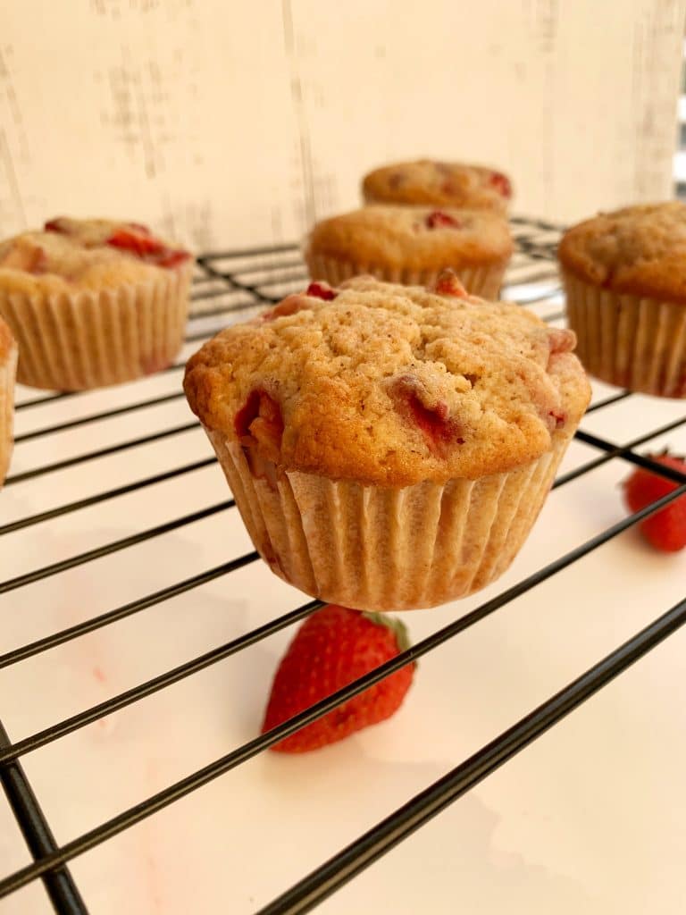 strawberry muffins on a wire rack