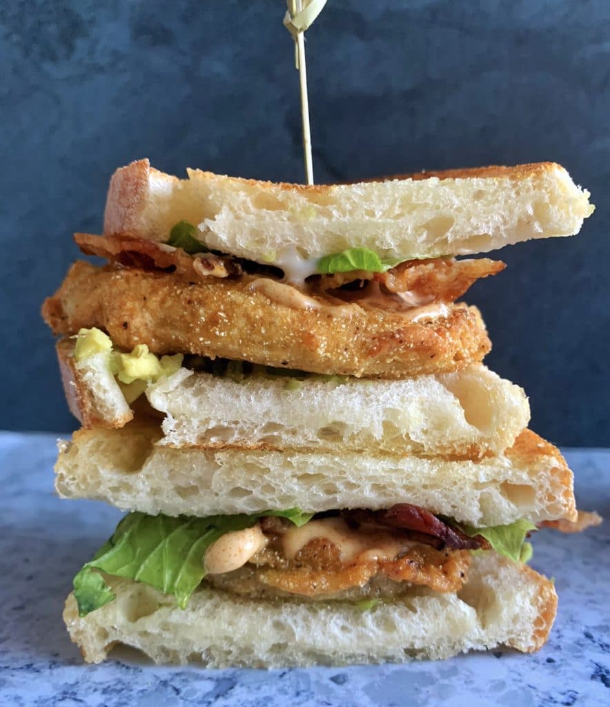 A stack of two Fried Green Tomato BLT sandwiches