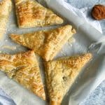 A pan of Roasted Sweet Potato Turnovers with maple glaze.