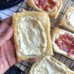 A hand holding a starbucks copycat cream cheese danish.