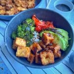 An overhead shot of a Crispy Air Fried Tofu Bowl with more tofu on the side.