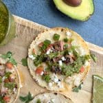 A chimichurri steak taco made with flank steak and a corn tortilla.