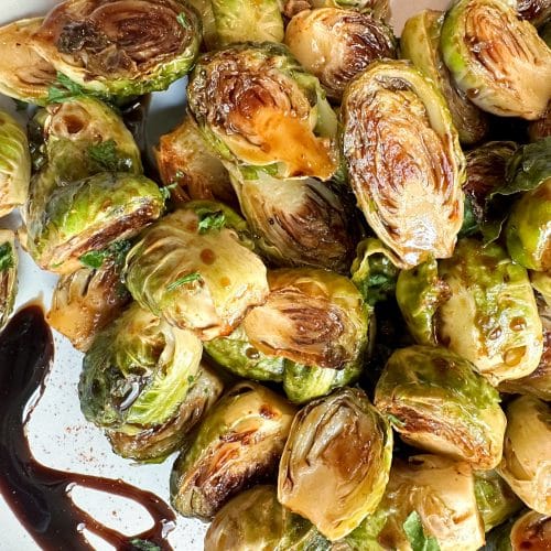 A closeup shot of roasted balsamic Brussels sprouts.