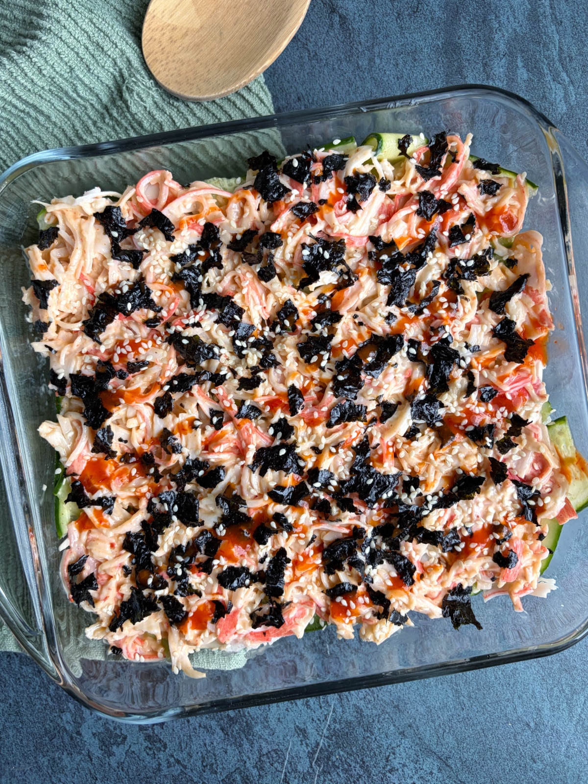 A casserole dish filled with sushi casserole.