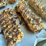 A closeup shot of a pan of No-Bake Granola Bars with peanut butter and chocolate.