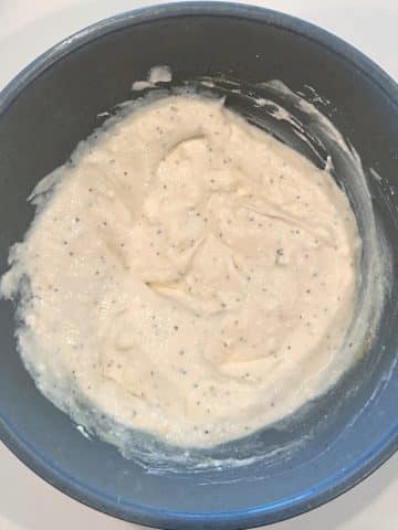 A mixing bowl of coleslaw dressing.