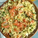 A large serving of Italian Orzo Pasta Salad in a wooden bowl.