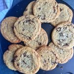 A black board filled with brown butter chocolate chip cookies.