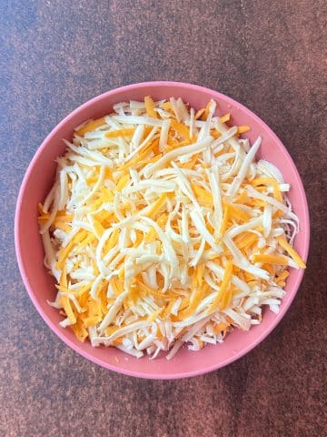 A bowl of freshly shredded cheese.
