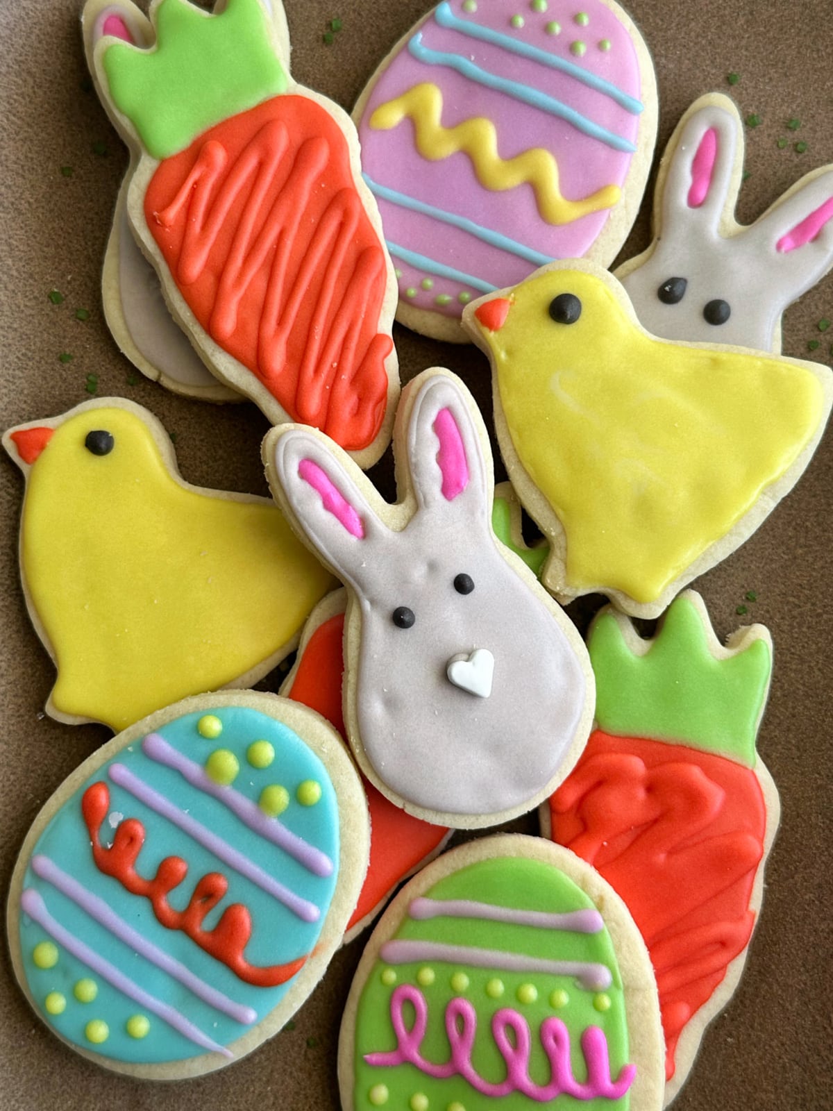 A pile of Easter Cut Out Cookies stacked on top of each other.