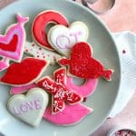 A plate of Valentine's Day-decorated cut out sugar cookies.