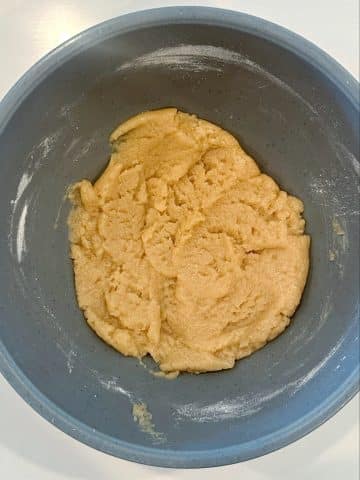 A bowl filled with shortbread cookie dough.