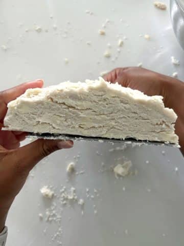 A cross shot of a piece of homemade all butter pie crust.